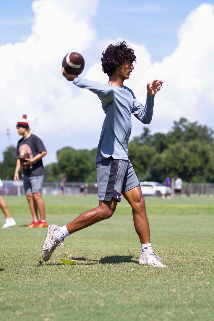 Quarterback completing a throwing motion