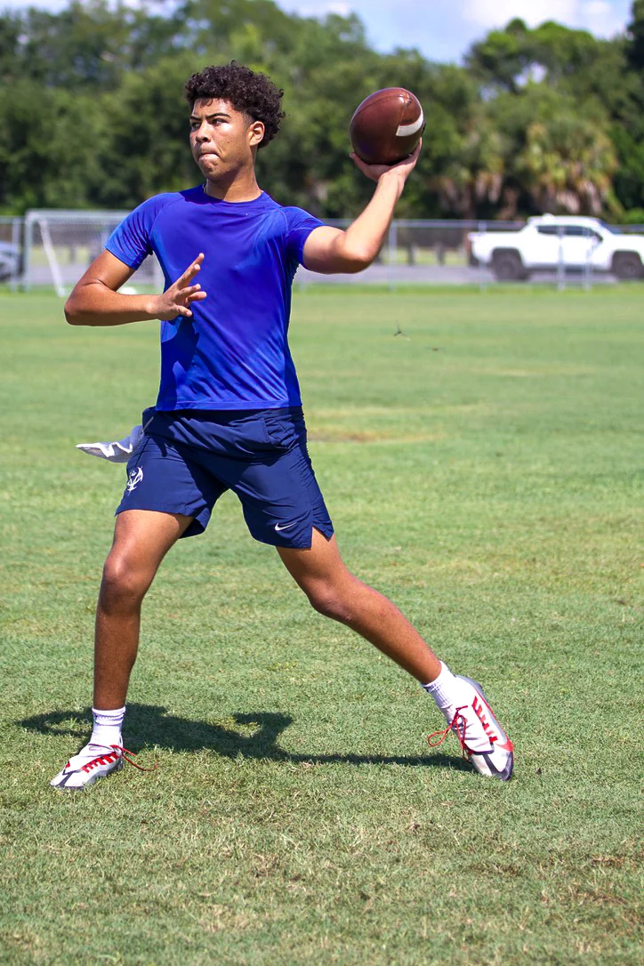 Quarterback preparing to throw during a QB Stable field session