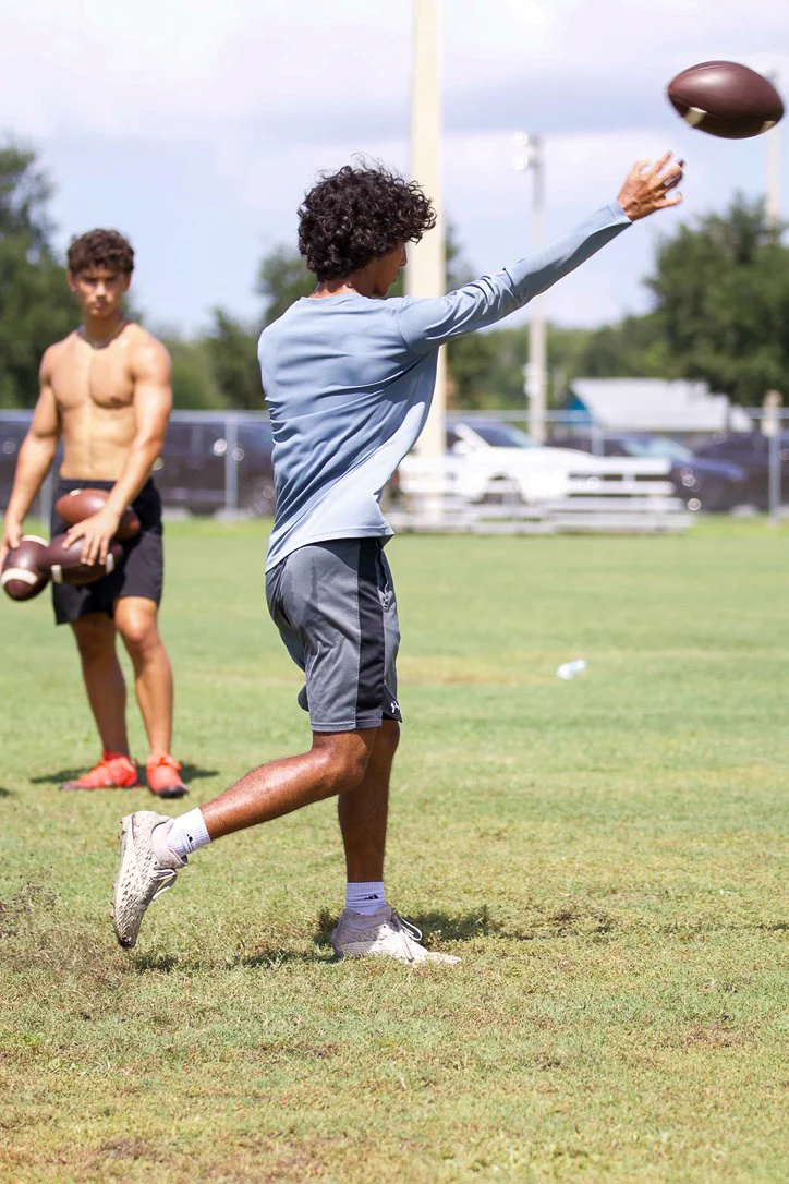 Quarterback finishing a throw